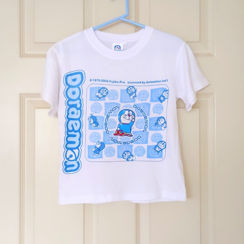 NWOT. 100% Cotton Short Sleeve Tee w/3D Doraemon Character/multi Doraemon print.